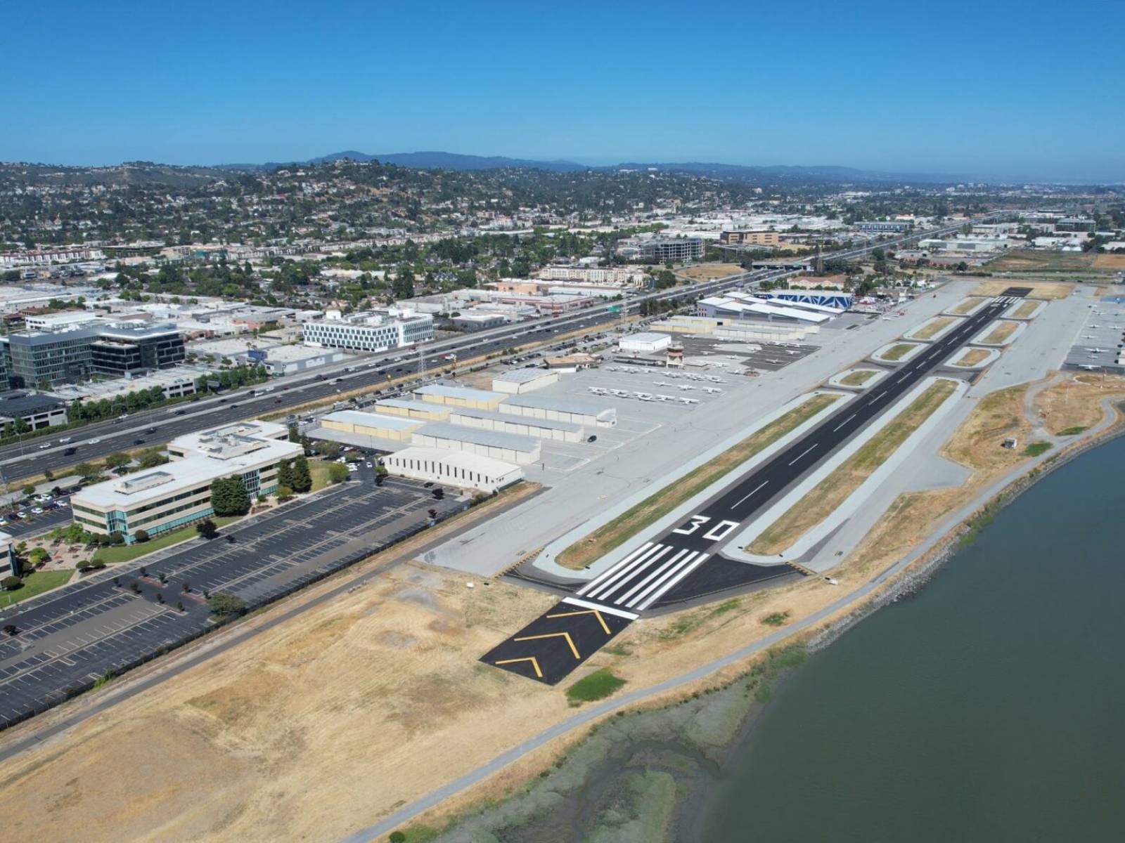 Aerial view of San Carlos Airport and runway 30